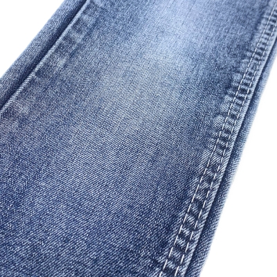 GX-AF B6024 Width: 178-180cm Weight: 9.6OZ Shrinkage: Warp:6-7% Weft:13-15% Weave: Right-hand twill Composition: 64.0% Cotton, 31.5% Tencel , 3.6% Rayon, 0.9% Spandex 10 count Slub yarn Super Sirospun TR dual core Medium stretch detail view-2